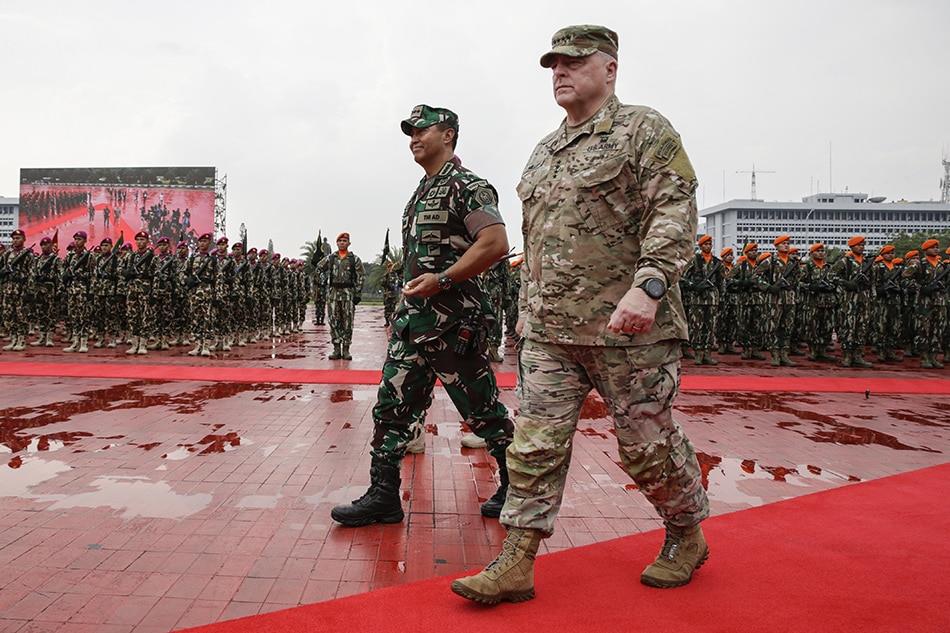 US  Chairman  of  the  Joint  Chiefs  of  Staff  General  Mark  Milley  (R) and  Indonesia's  Armed  Forces  Chief  General  Andika  Perkasa  (L) inspect  the  lines  of  honor  during  their  meeting  at  the  Indonesian  military  headquarters  in  Jakarta, Indonesia, July  24, 2022. Milley  is  on  a  visit  to  the  Southeast  Asian  nation  to  tighten  military  relationships  between  the  2 countries. Mast  Irham, EPA-EFE