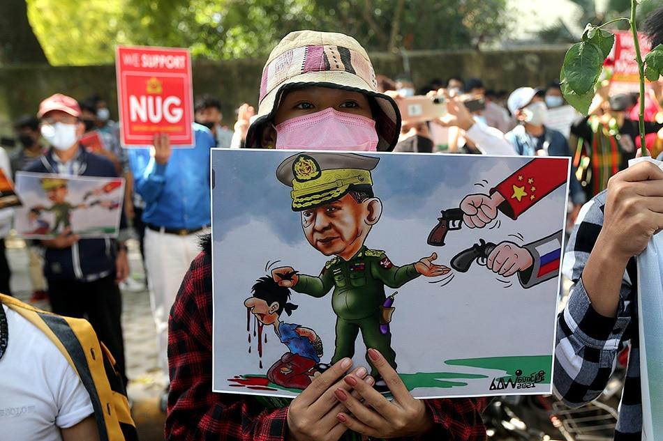 Indian  Myanmar's  pro-democracy  activists  and  Myanmar  refugees  living  in  India  hold  posters  and  placards  as  they  participate  in  a  protest  against  the  Myanmar's  military  rule  in  New  Delhi, India, Feb. 22, 2022. Hundreds  of  pro-democracy  and  Rohingya  Human  Rights  Initiative  activists  gathered  and  held  a  protest  to  show  solidarity  to  with  victims  of  military  rule  in  Myanmar. Harish  Tyagi, EPA-EFE