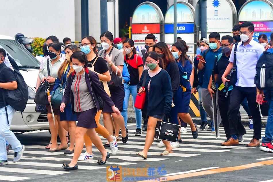 Pedestrians  walk  at  a  crossing  in  Makati  City  ABS-CBN  News